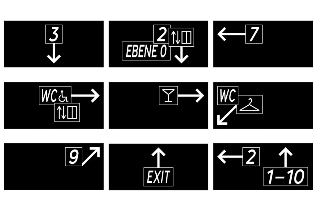 Various direction signs. Black and white with large lettering and arrows