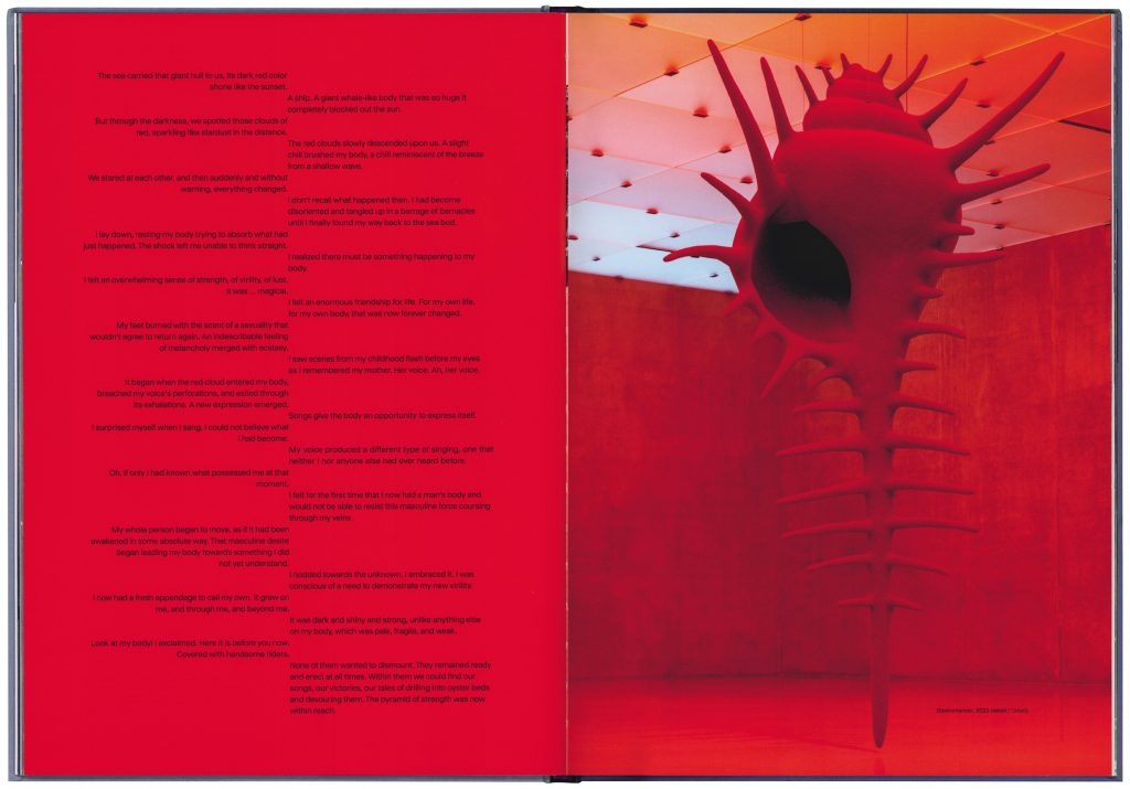 Red double page with text and image of a red scultpure