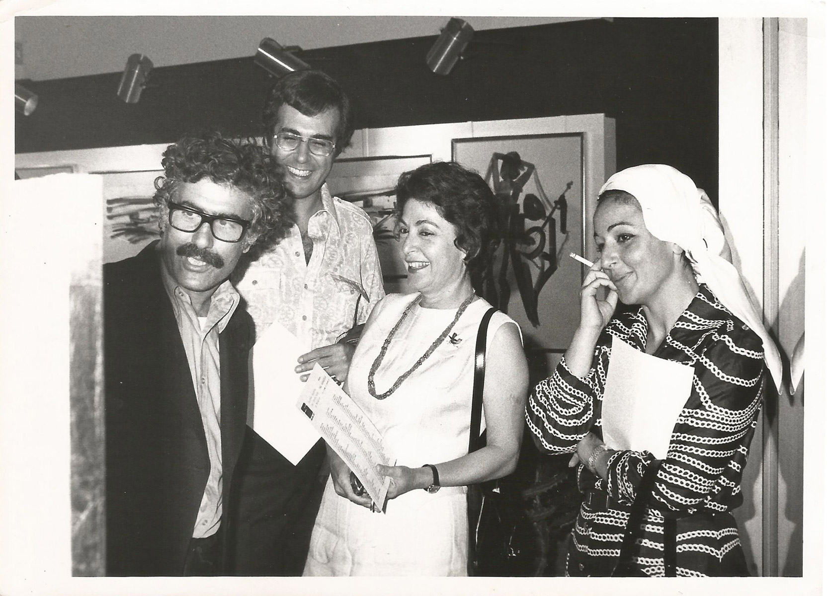 Photograph of Paul Guiragossian with guests at Studio 27, 1972.  Courtesy Paul Guiragossian Archives
