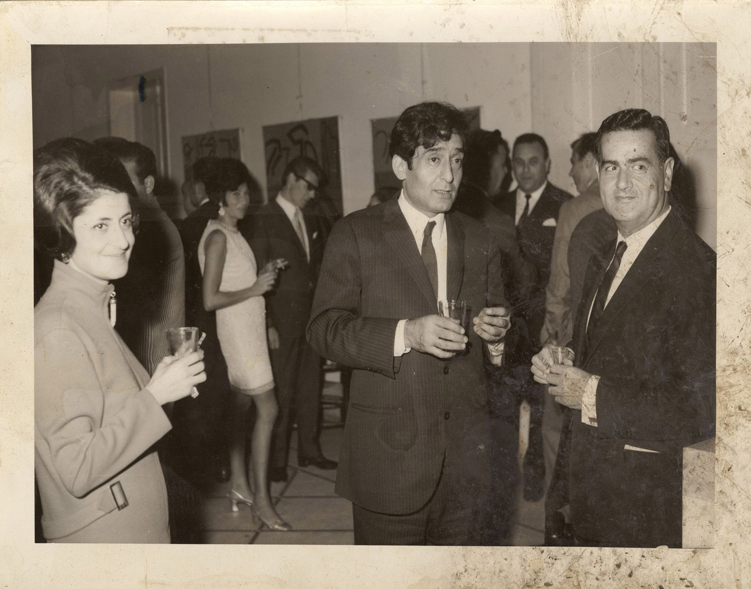 Photograph of Aref Rayess in Hussein Made Exhibition opening in Dar el Fan, 1968. Courtesy of Aref Rayess Foundation